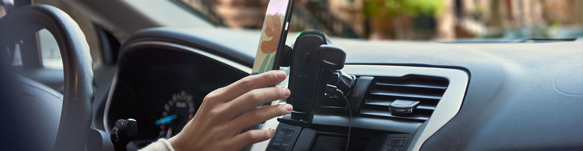eotw2_cd-vent_feature-image00 user mounting phone in their car on the easy one touch wireless 2 air vent & cd slot mount