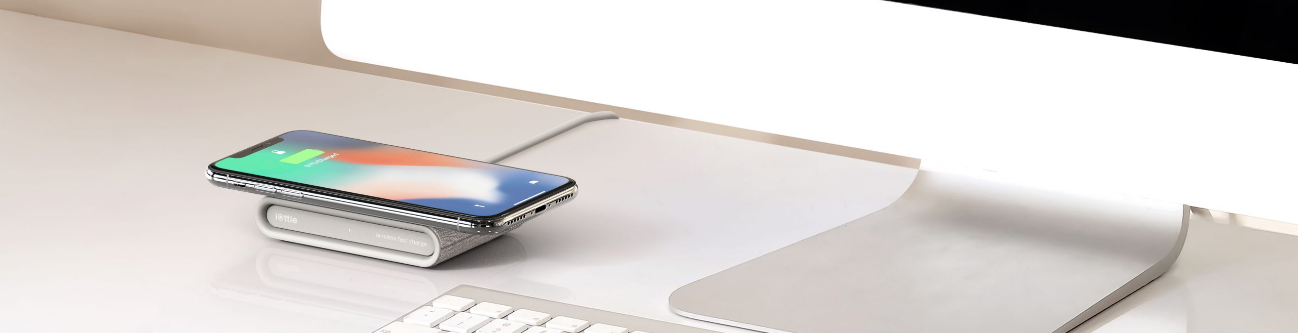 iottie.comionw-mini_ivory_lifestyle iON Wireless Mini Charging Pad in Ivory on Office Desk