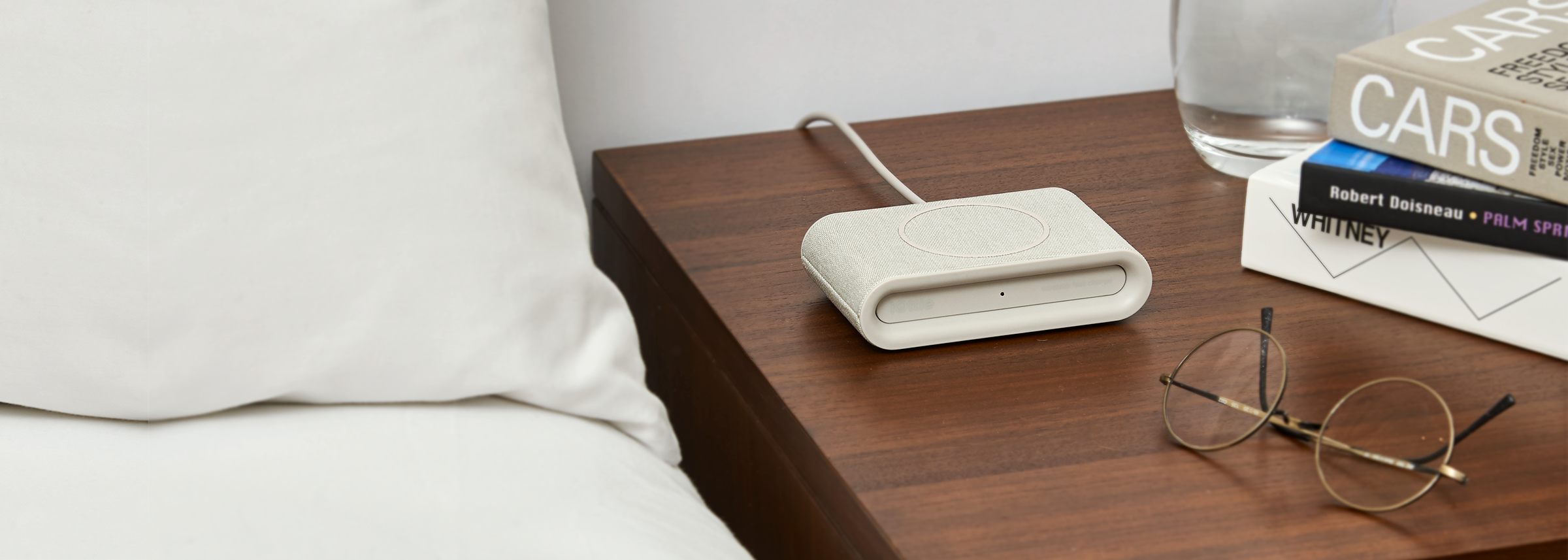 iON Wireless Plus Charging Pad in Ivory on Bedside Table