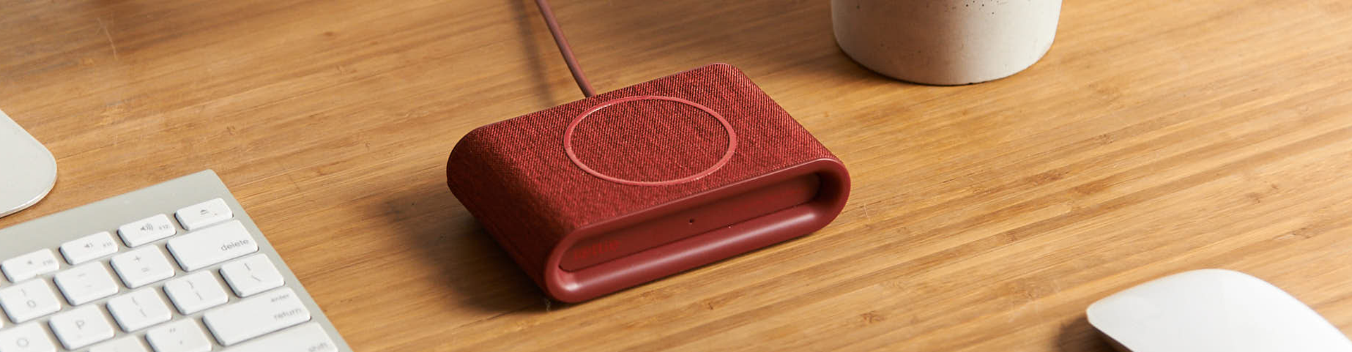 iottie.comionw-plus_ruby_lifestyle iON Wireless Plus Charging Pad in Ruby on Desk