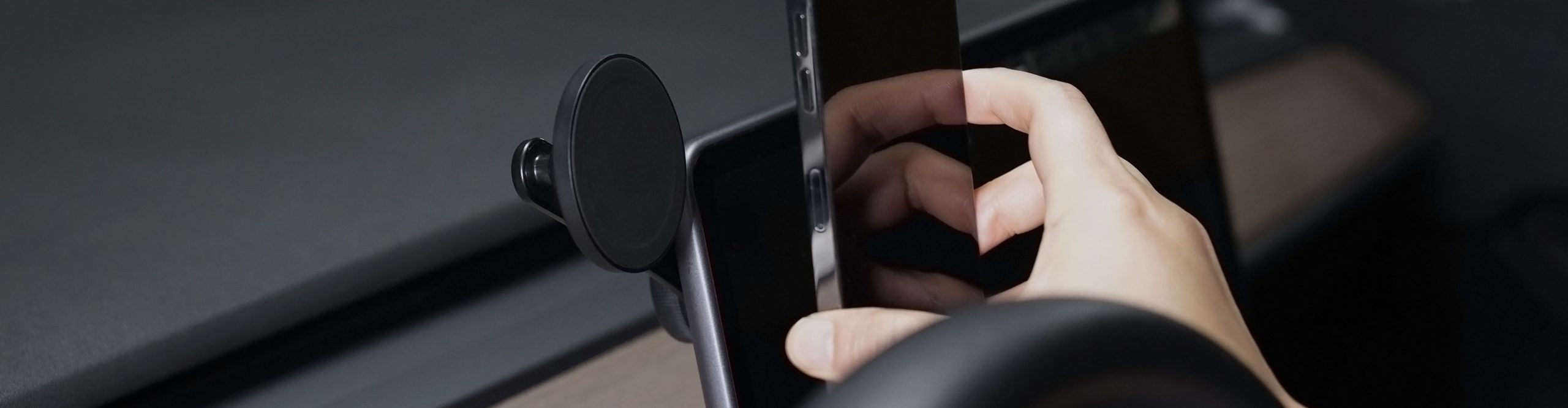 Person Mounting an iPhone on the Terus Monitor Mount